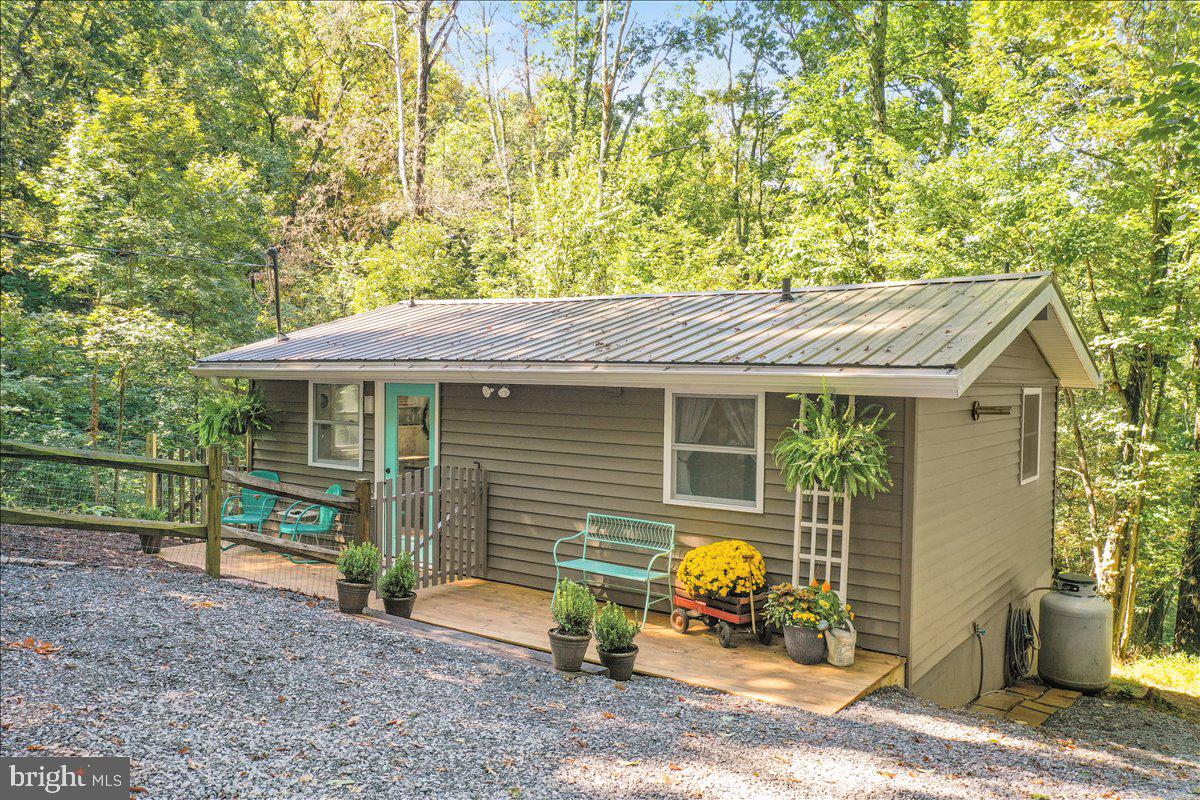 570 Cedar Road Strasburg, VA 22657 - Photo 2 of 47 a view of house with backyard outdoor seating area and barbeque oven