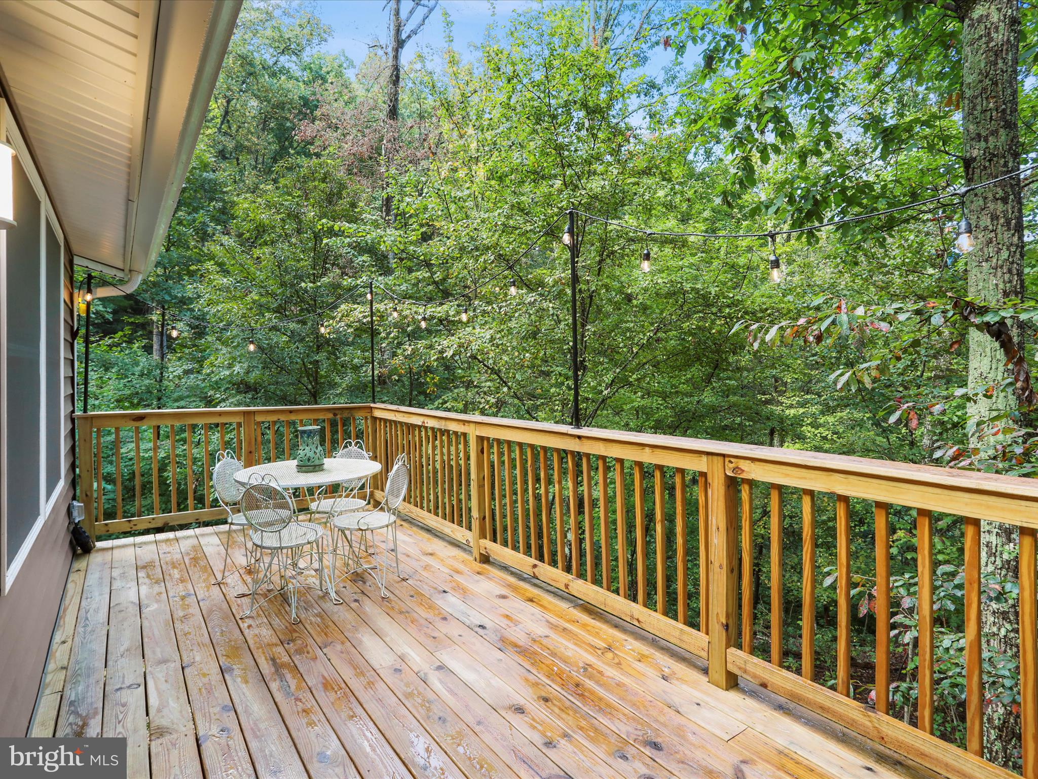 570 Cedar Road Strasburg, VA 22657 - Photo 21 of 47 a balcony with wooden floor and outdoor space