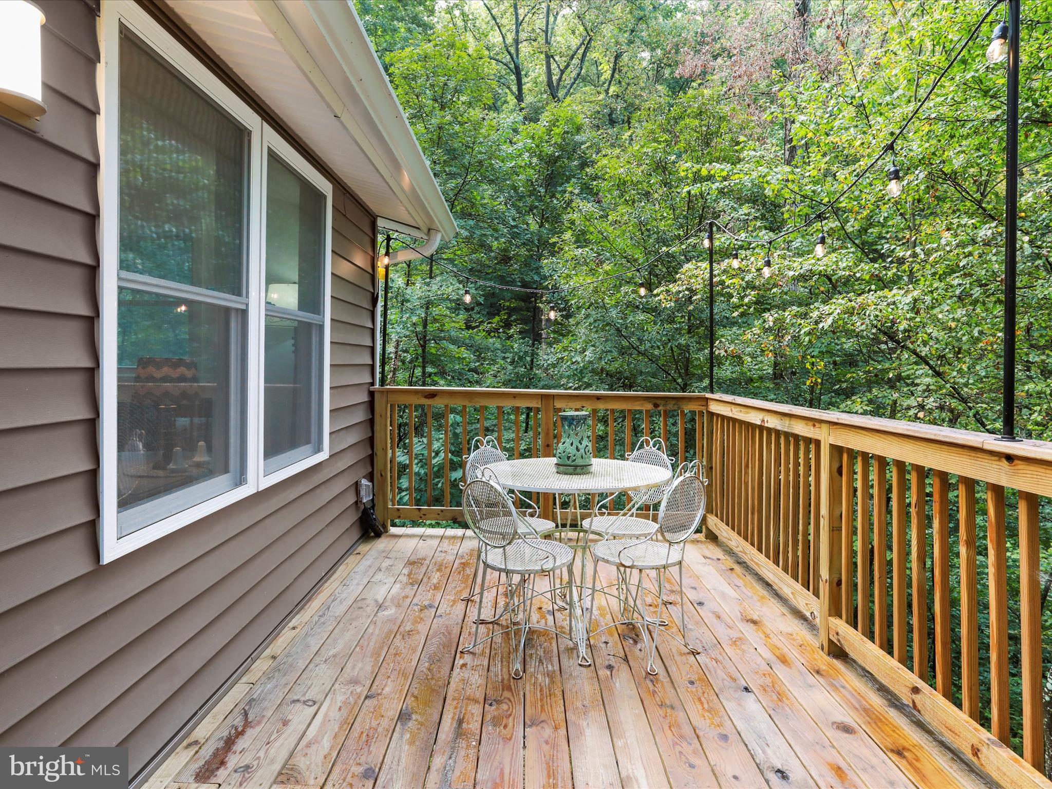 570 Cedar Road Strasburg, VA 22657 - Photo 22 of 47 a view of balcony with furniture and wooden floor