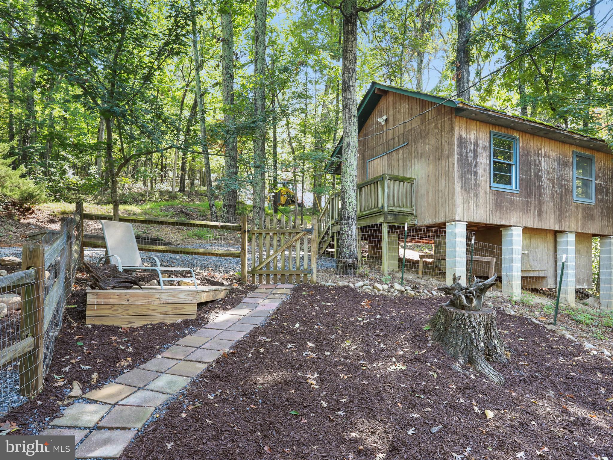 570 Cedar Road Strasburg, VA 22657 - Photo 29 of 47 a view of a house with backyard and sitting area