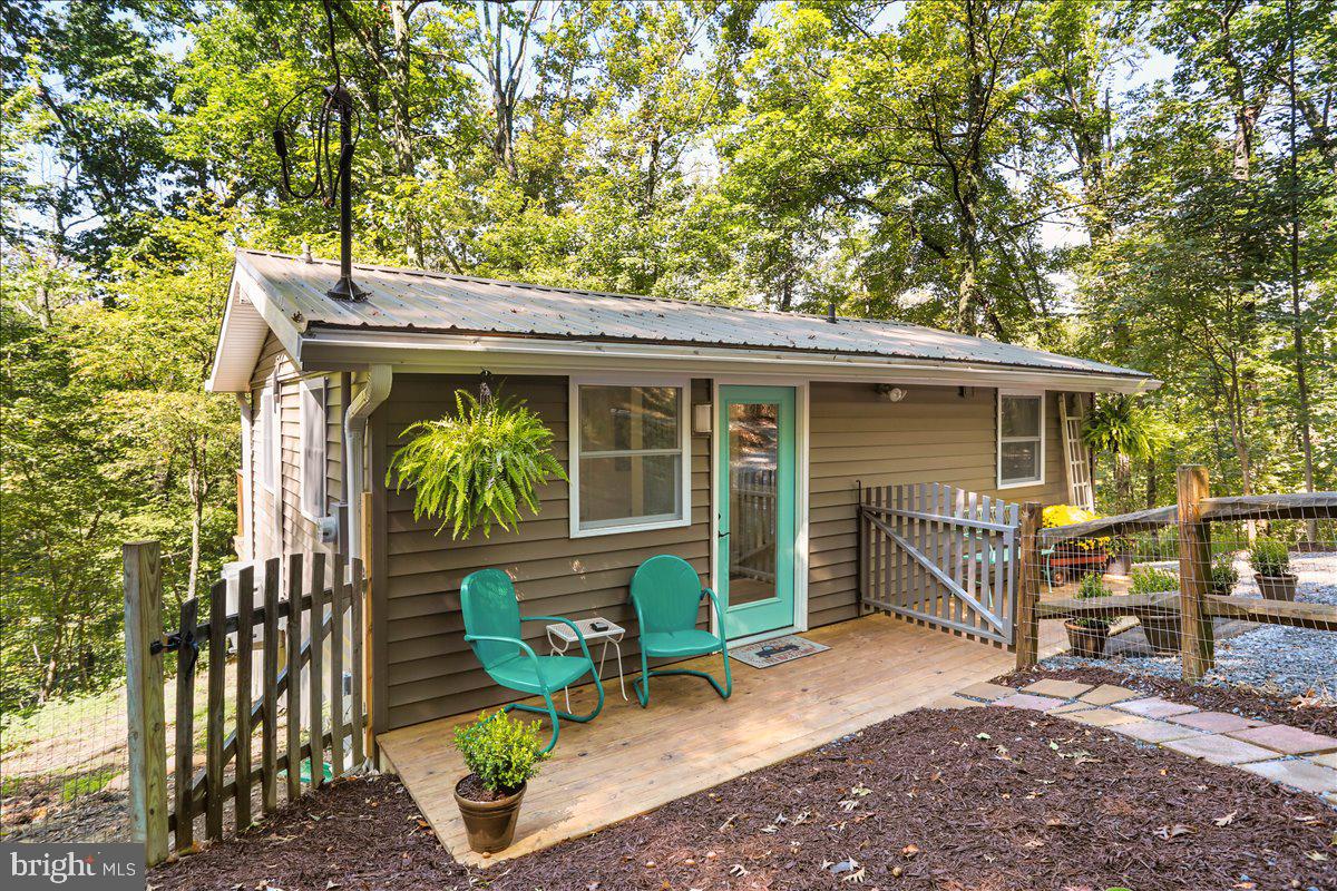 570 Cedar Road Strasburg, VA 22657 - Photo 30 of 47 a front view of a house with garden
