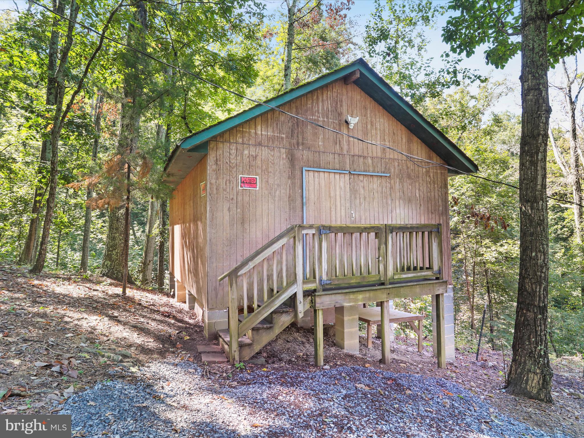 570 Cedar Road Strasburg, VA 22657 - Photo 31 of 47 a view of a small house with a yard and wooden fence