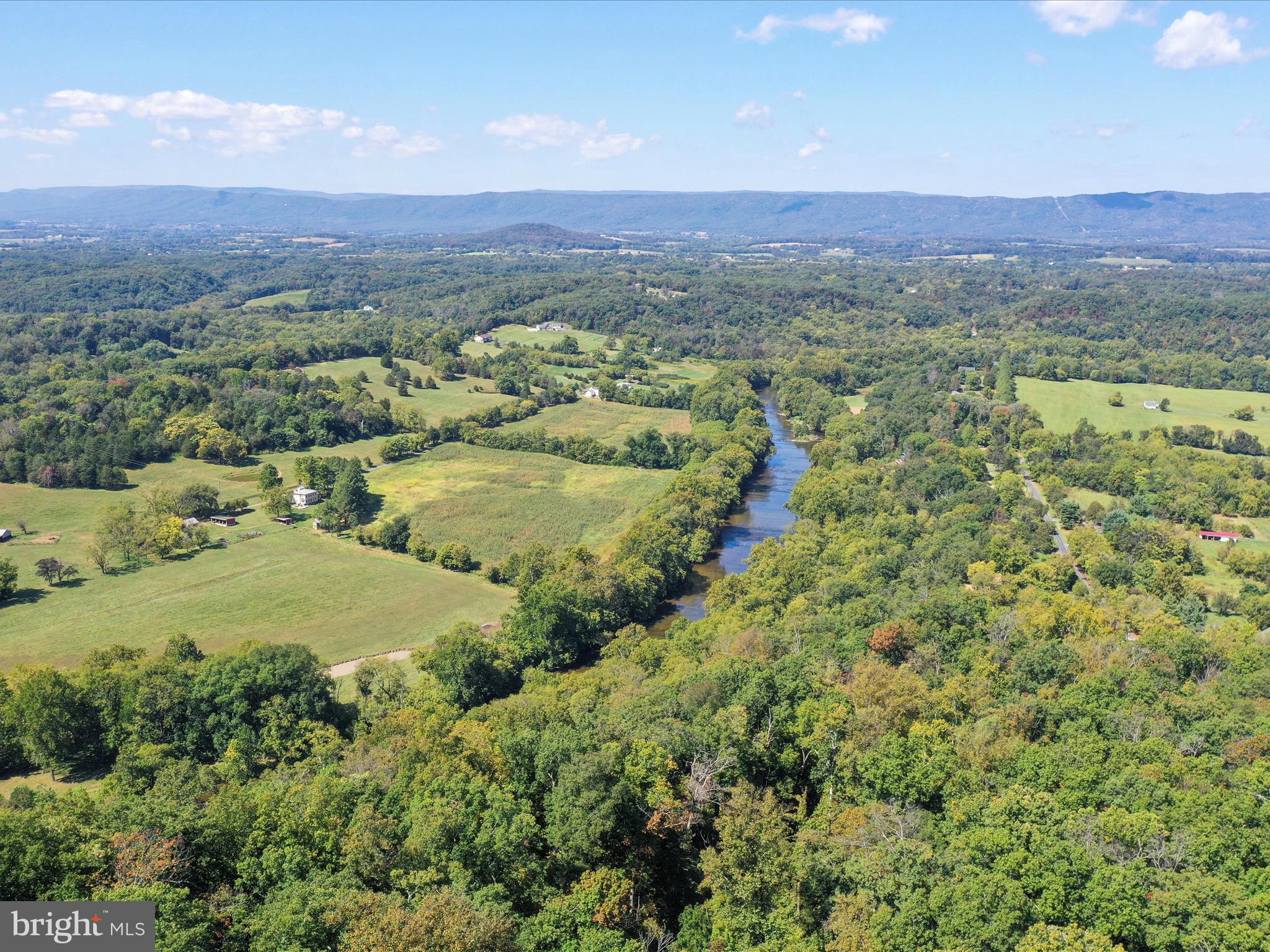 570 Cedar Road Strasburg, VA 22657 - Photo 35 of 47 a view of a lush green hillside and houses