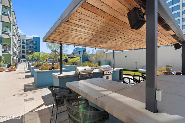 a view of a city from a balcony with plants