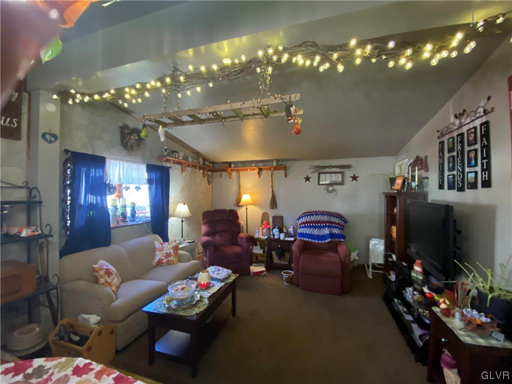 118 East Ruddle Street Coaldale, PA 18218 - Photo 15 of 42 a living room with furniture chandelier and kitchen view