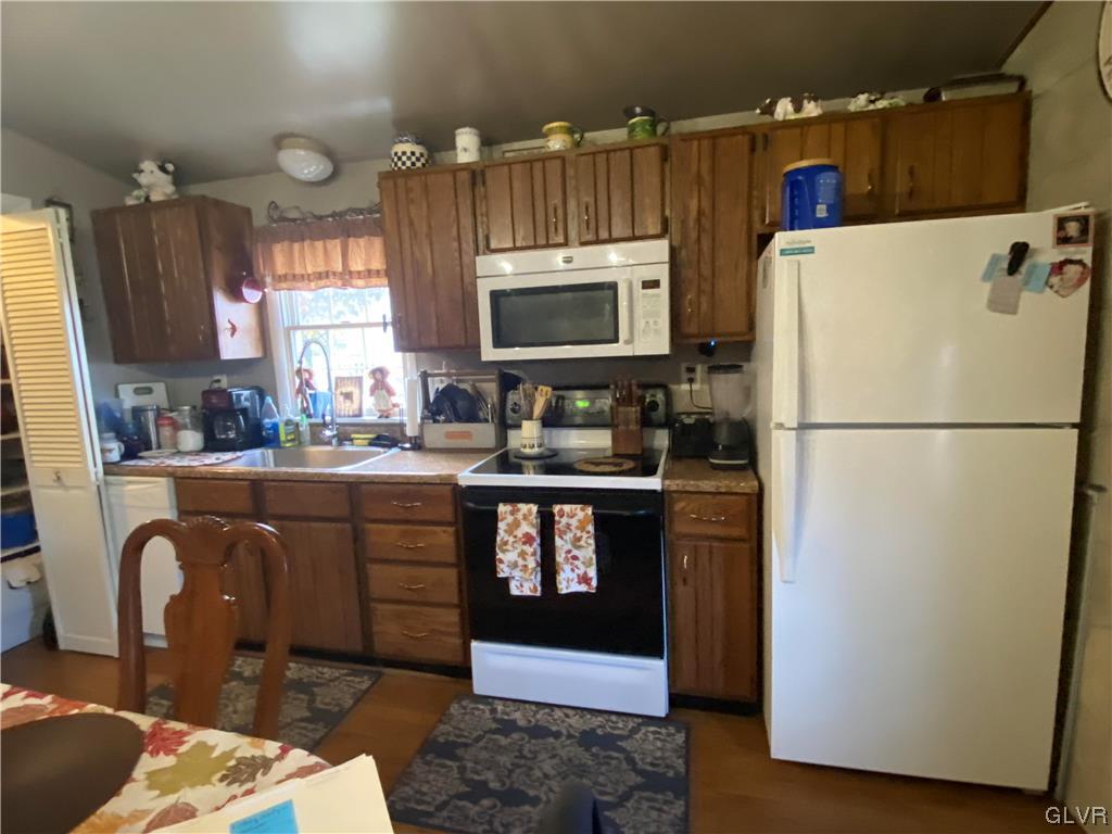 118 East Ruddle Street Coaldale, PA 18218 - Photo 18 of 42 a kitchen with stainless steel appliances granite countertop a refrigerator a stove a sink and a microwave