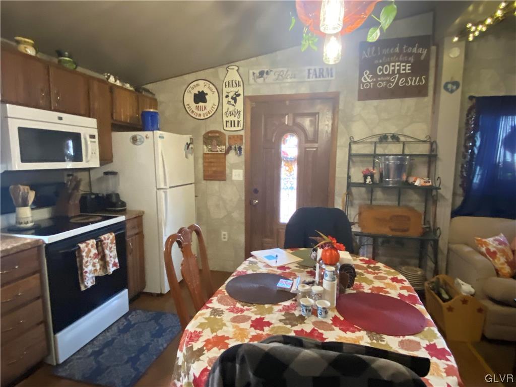 118 East Ruddle Street Coaldale, PA 18218 - Photo 22 of 42 a bedroom with a bed and a table with wooden floor