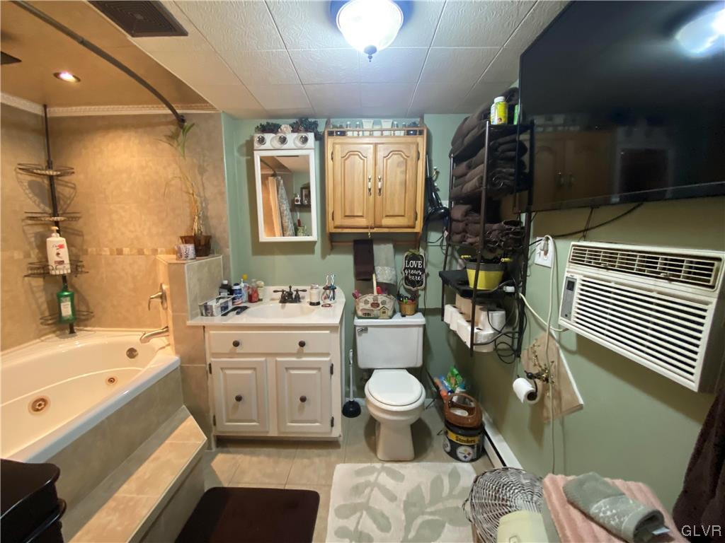 118 East Ruddle Street Coaldale, PA 18218 - Photo 25 of 42 a bathroom with a sink toilet a mirror and bathtub