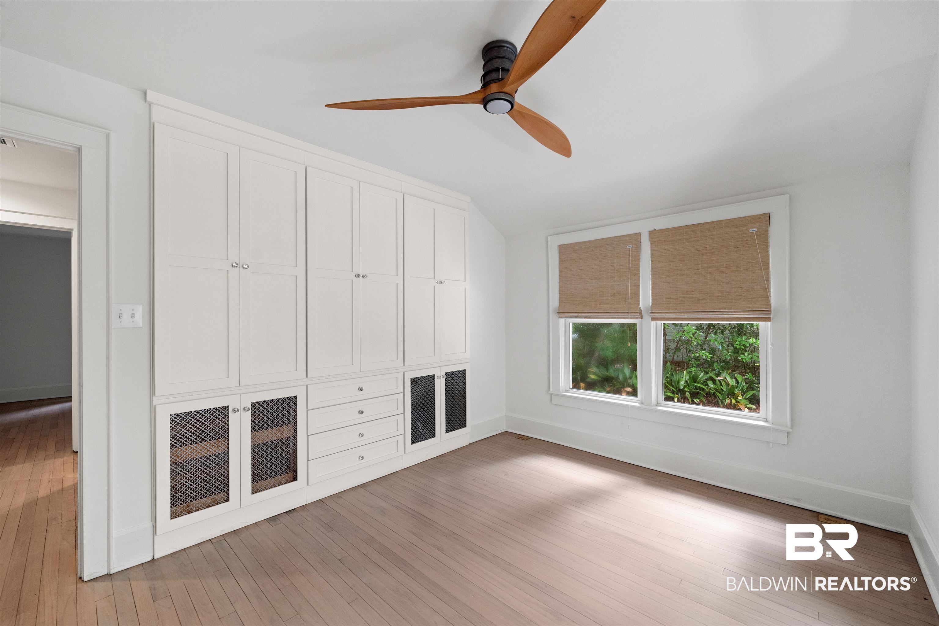 106 White Avenue Fairhope, AL 36532 - Photo 17 of 35 Unfurnished bedroom with light wood-style floors, ceiling fan, lofted ceiling, and a closet