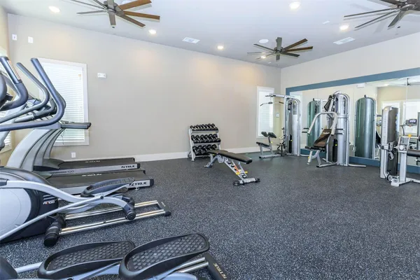 a front view of a house with swimming pool and porch