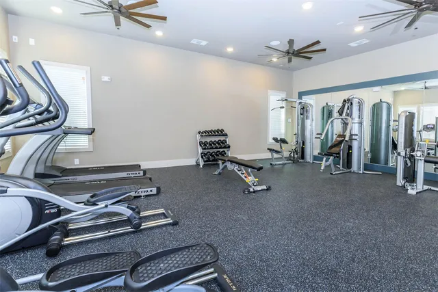 a front view of a house with swimming pool and porch