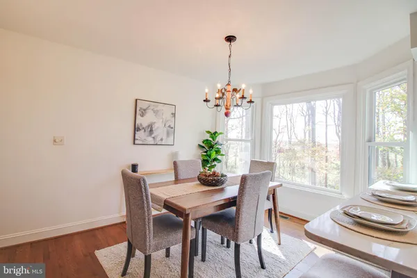 a living room with furniture fireplace and a table