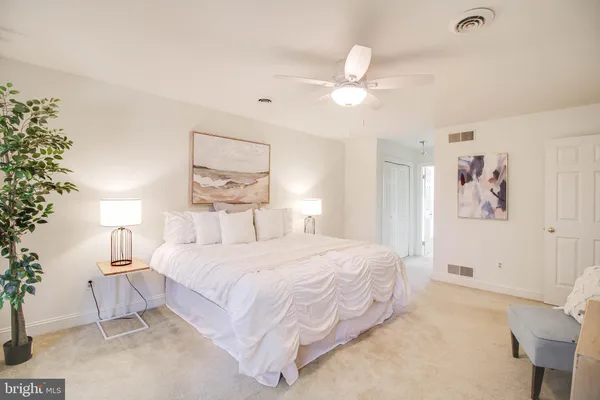 an empty room with a windows and closet