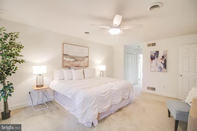 an empty room with a windows and closet