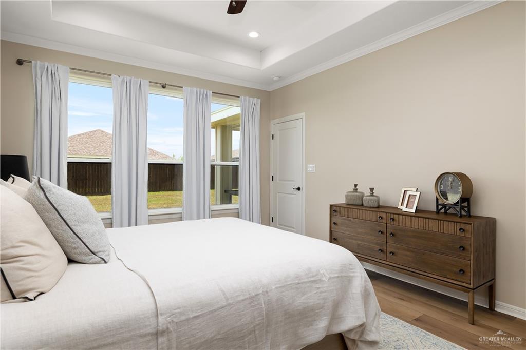 6343 Cascada Bnd Road McAllen, TX 78504 - Photo 20 of 35 a bedroom with a bed and a large window