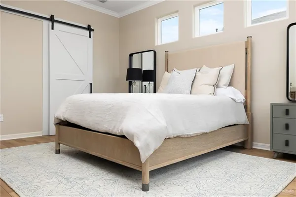 a bedroom with a bed and a walk in closet