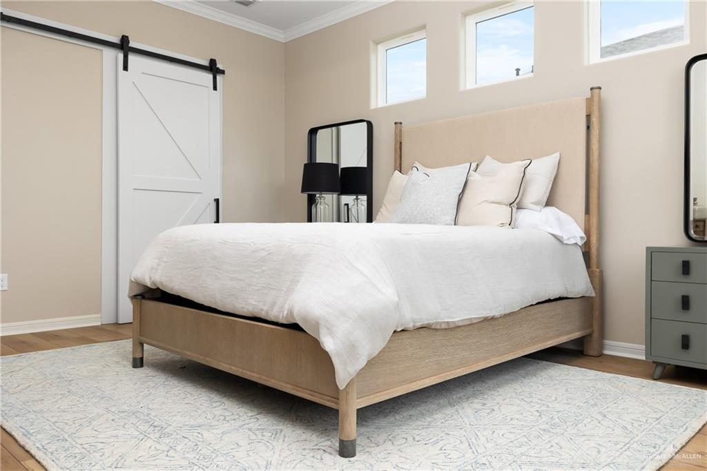 6343 Cascada Bnd Road McAllen, TX 78504 - Photo 21 of 35 a bedroom with a bed and a walk in closet
