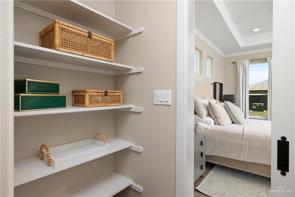 6343 Cascada Bnd Road McAllen, TX 78504 - Photo 22 of 35 a view of bedroom with a car parked in it