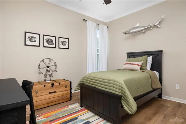 a bed sitting in a bedroom next to a window