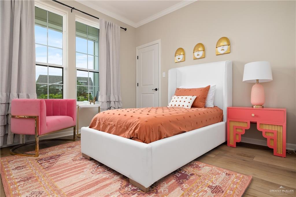 6343 Cascada Bnd Road McAllen, TX 78504 - Photo 25 of 35 a bed room with a bed and a chair
