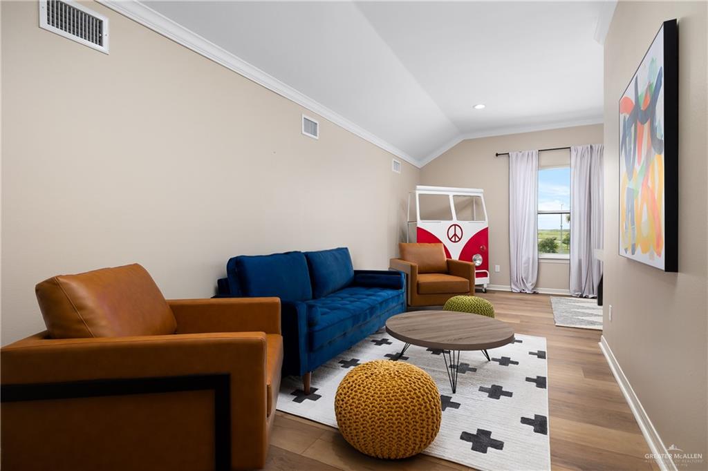 6343 Cascada Bnd Road McAllen, TX 78504 - Photo 28 of 35 a living room with furniture and a couch