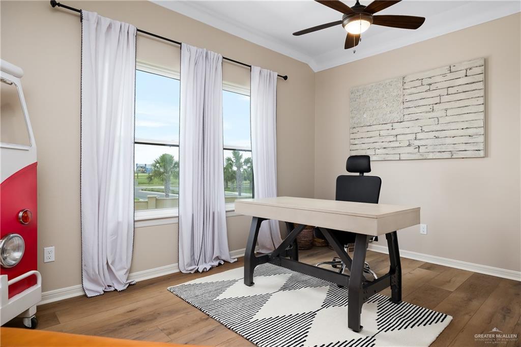 6343 Cascada Bnd Road McAllen, TX 78504 - Photo 30 of 35 a view of a workspace with furniture and a window
