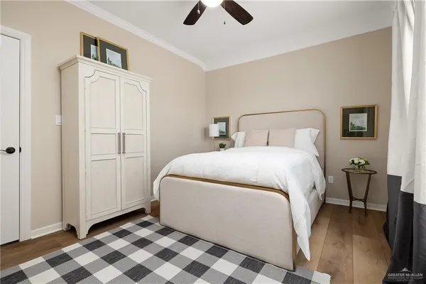 a bed room with a bed and a chandelier