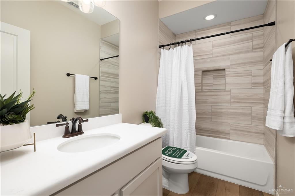 6343 Cascada Bnd Road McAllen, TX 78504 - Photo 32 of 35 a bathroom with a sink a toilet and a bathtub