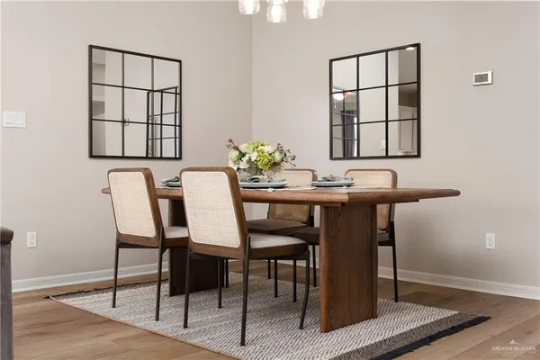 a dining room with furniture and window