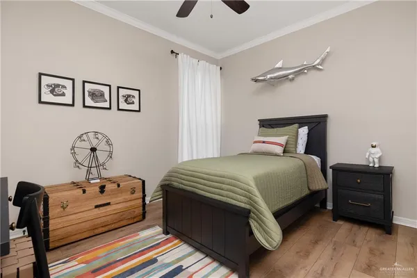 a bedroom with a bed and a tv