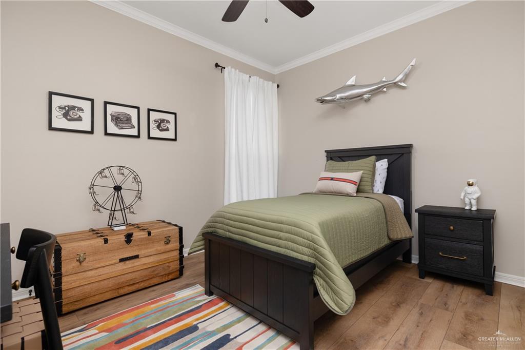 6343 Cascada Bnd Road McAllen, TX 78504 - Photo 35 of 35 a bedroom with a bed and a tv