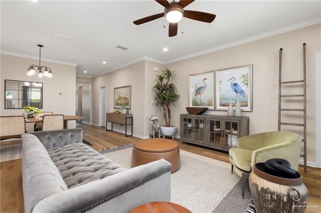 6343 Cascada Bnd Road McAllen, TX 78504 - Photo 4 of 35 a living room with furniture and a chandelier
