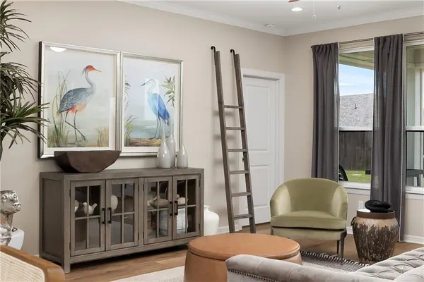 a living room with furniture and a large window