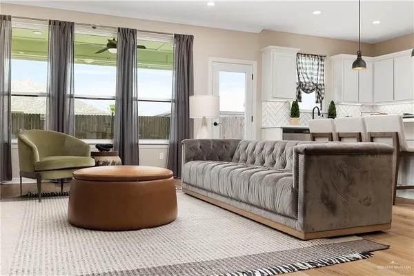 a living room with furniture and a large window