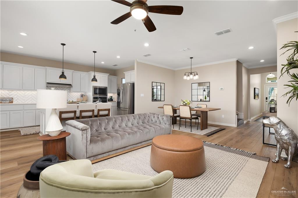6343 Cascada Bnd Road McAllen, TX 78504 - Photo 8 of 35 a living room with furniture and kitchen view