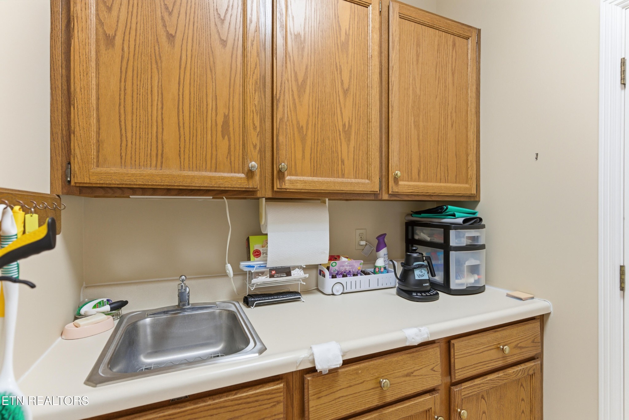 92 North Claymore Lane Oak Ridge, TN 37830 - Photo 27 of 32 a kitchen with a sink cabinets and utility