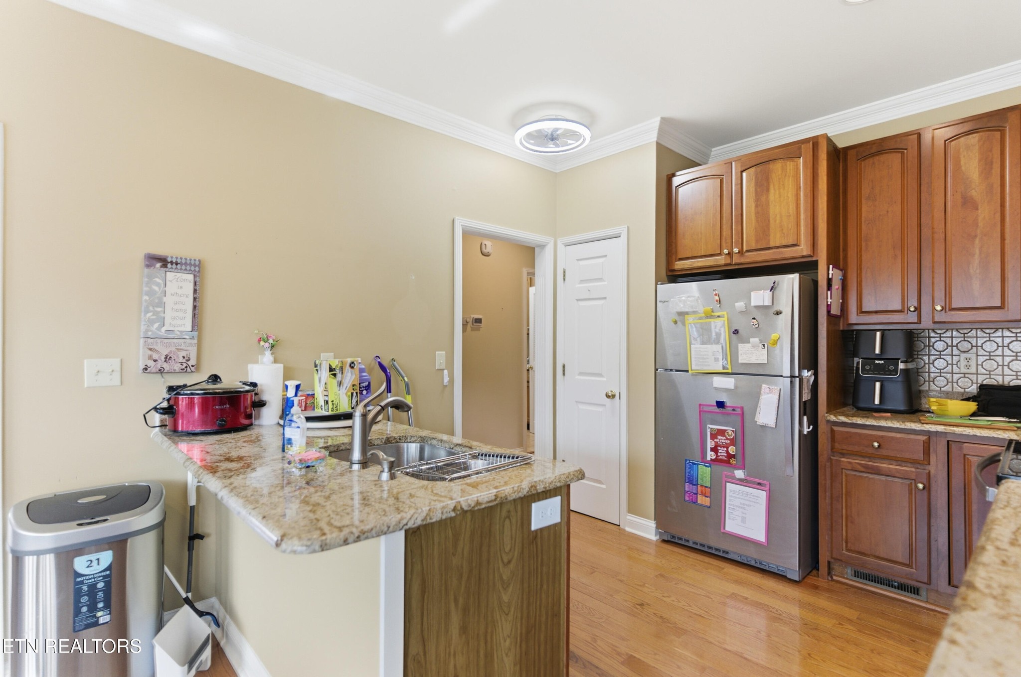 92 North Claymore Lane Oak Ridge, TN 37830 - Photo 9 of 32 a kitchen with granite countertop a sink and cabinets