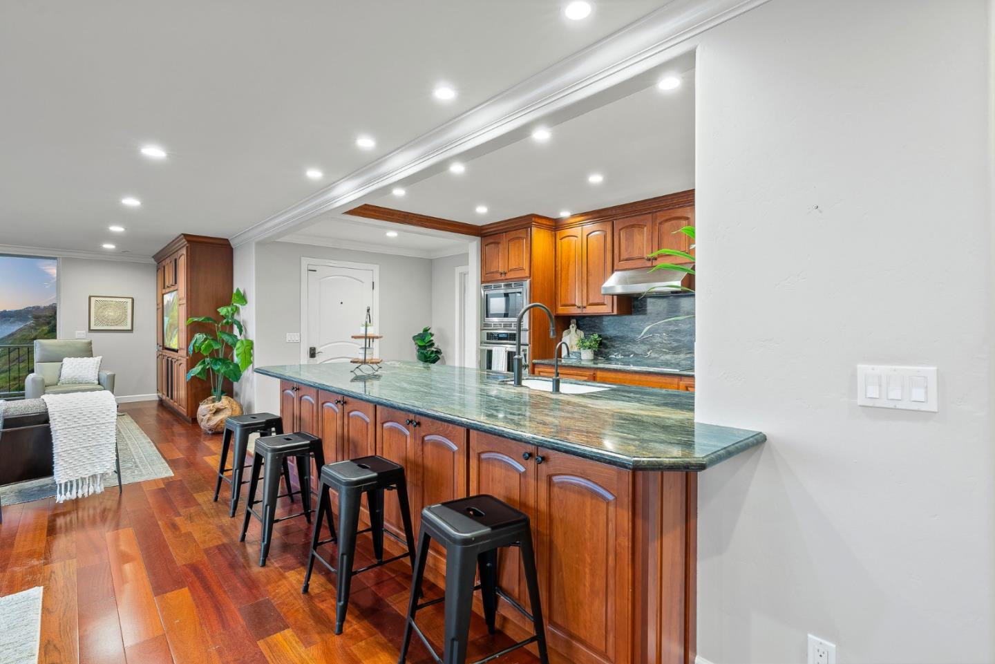 300 Oceanview Drive, Unit 401 La Selva Beach, CA 95076 - Photo 20 of 44 a kitchen with stainless steel appliances granite countertop a refrigerator and a view of living room