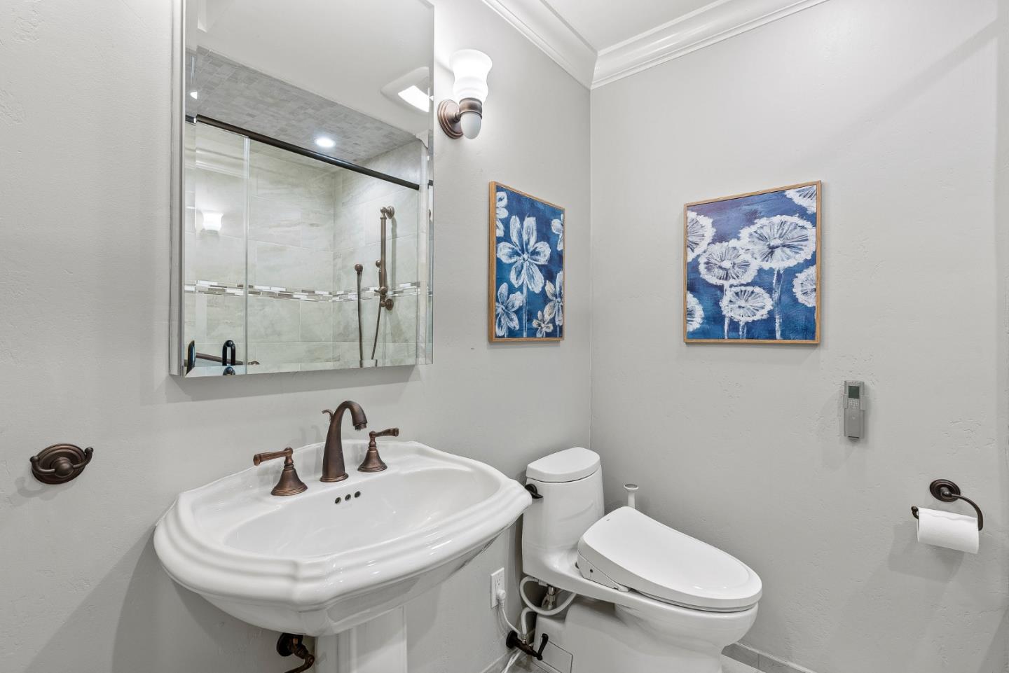 300 Oceanview Drive, Unit 401 La Selva Beach, CA 95076 - Photo 36 of 44 a bathroom with a toilet sink and mirror