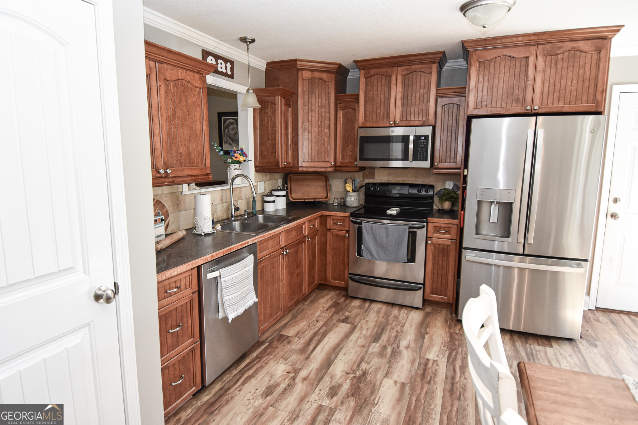 1515 Smyrna Church Road Molena, GA 30258 - Photo 14 of 34 a kitchen with stainless steel appliances a refrigerator sink and microwave