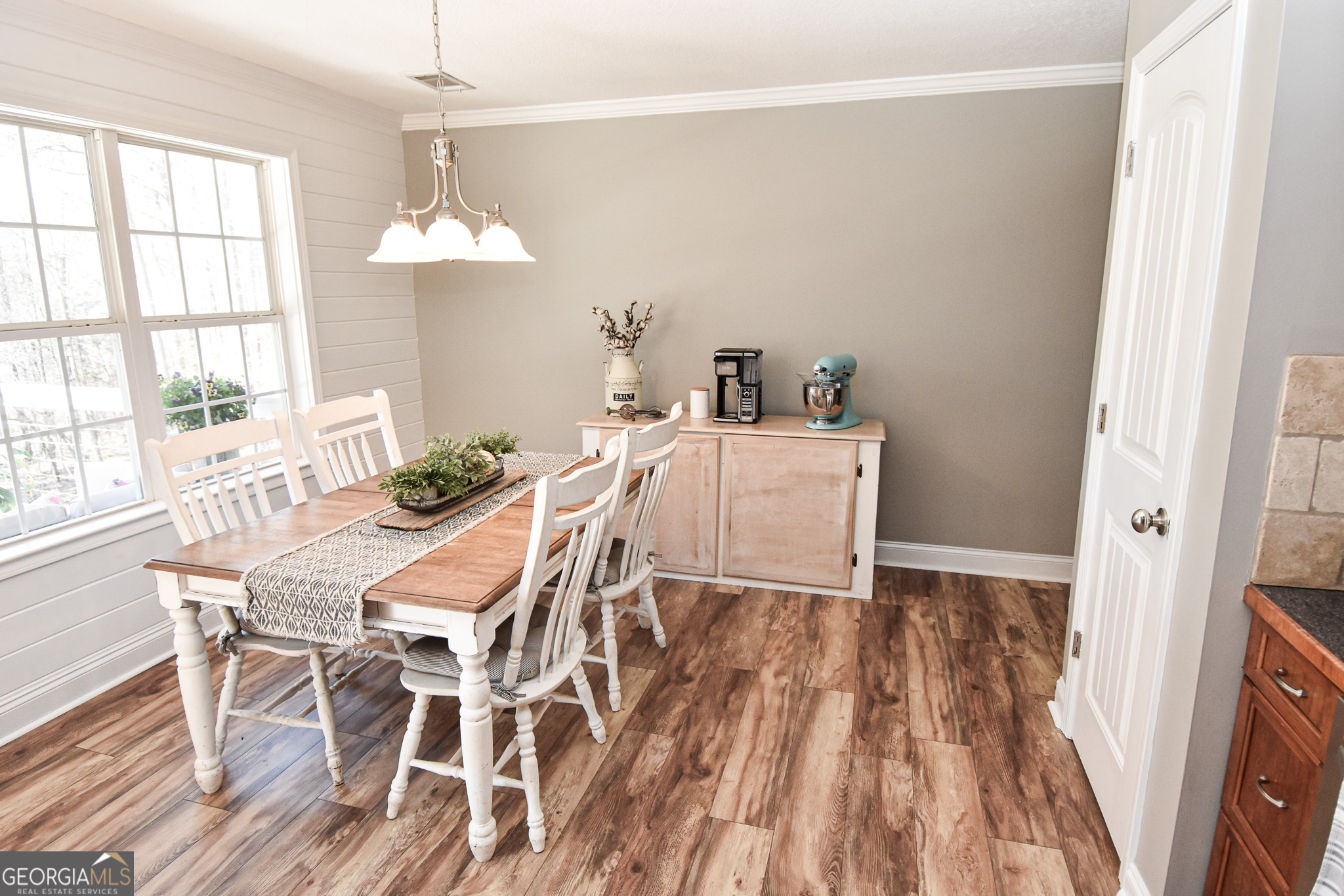 1515 Smyrna Church Road Molena, GA 30258 - Photo 17 of 34 a view of a dining room with furniture a chandelier and wooden floor