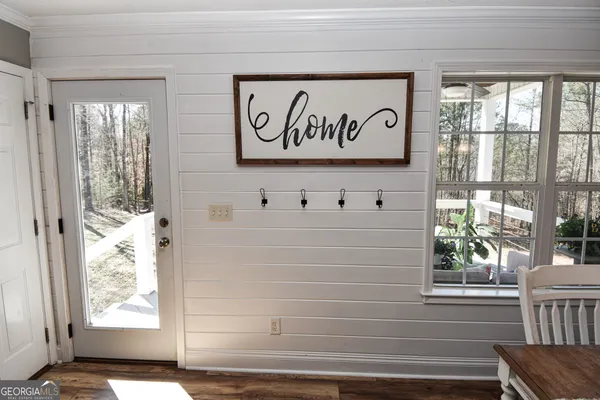 a view of wooden door with glass windows