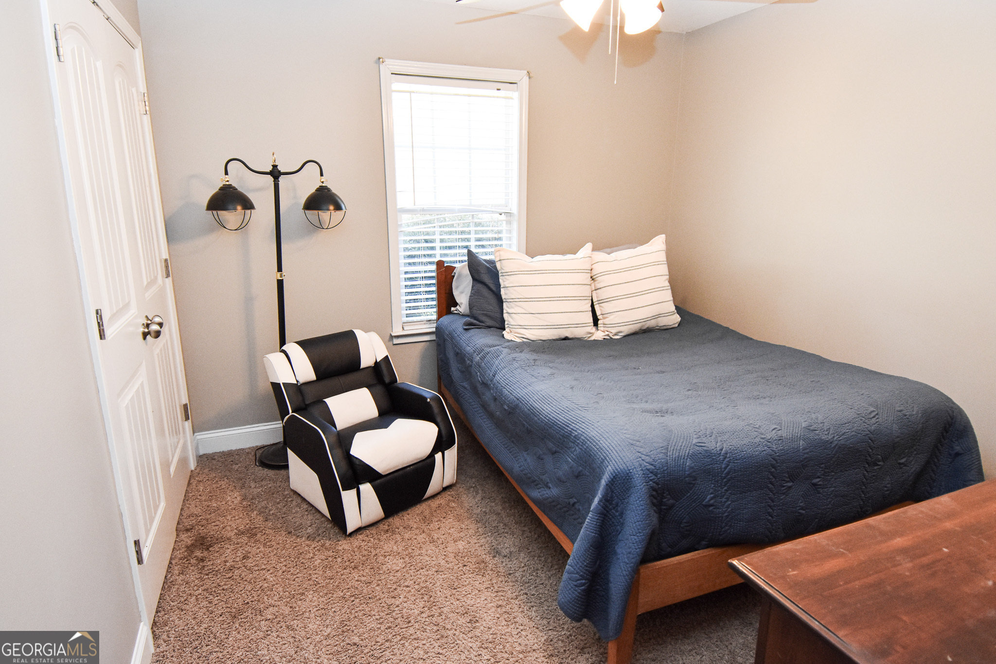 1515 Smyrna Church Road Molena, GA 30258 - Photo 22 of 34 a bed room with a bed and a chair