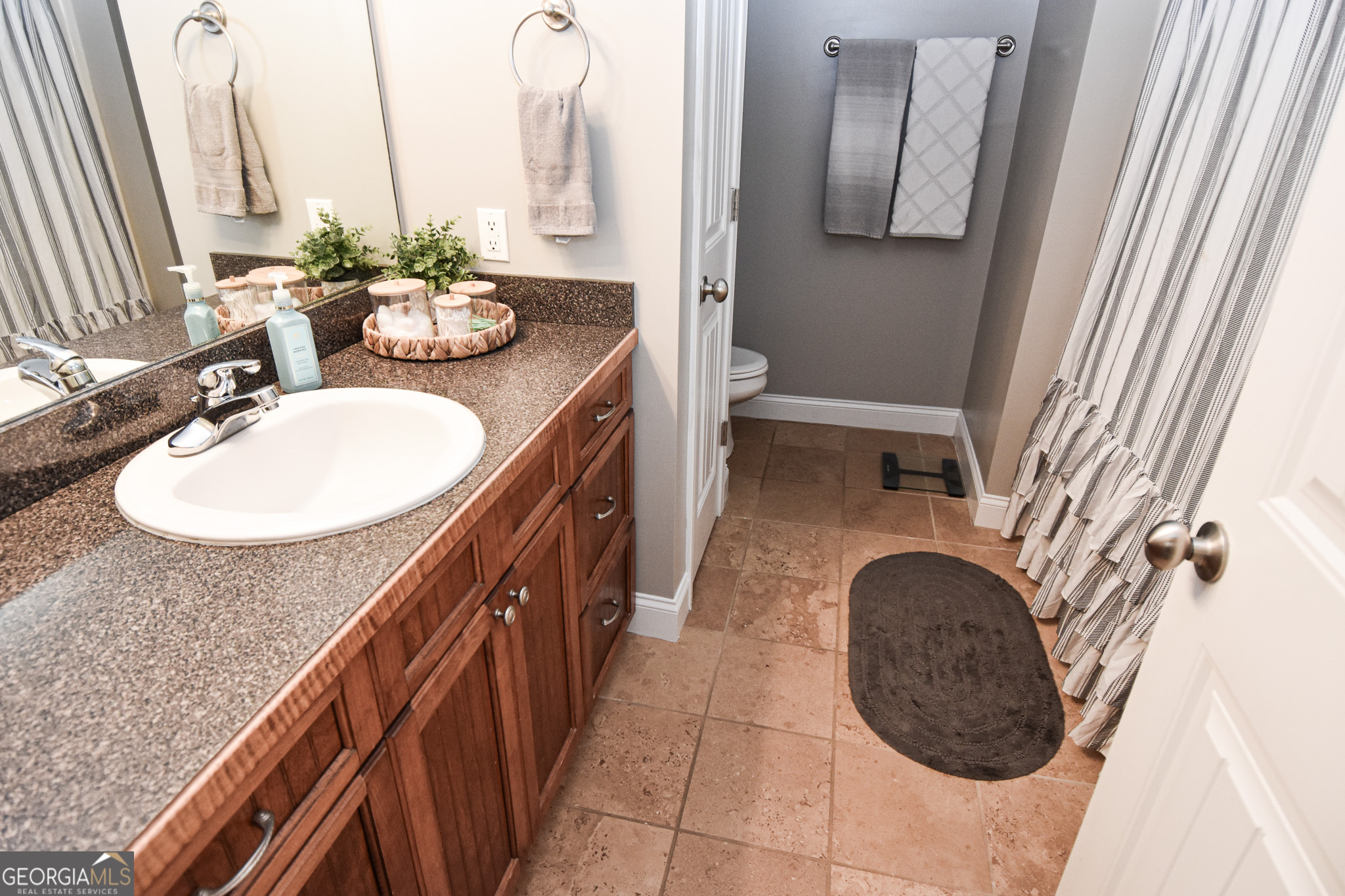 1515 Smyrna Church Road Molena, GA 30258 - Photo 28 of 34 a bathroom with a sink a mirror and vanity