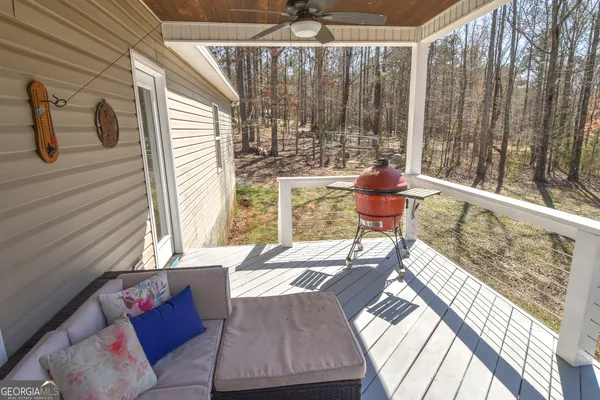 a living room with couches chairs and a coffee table