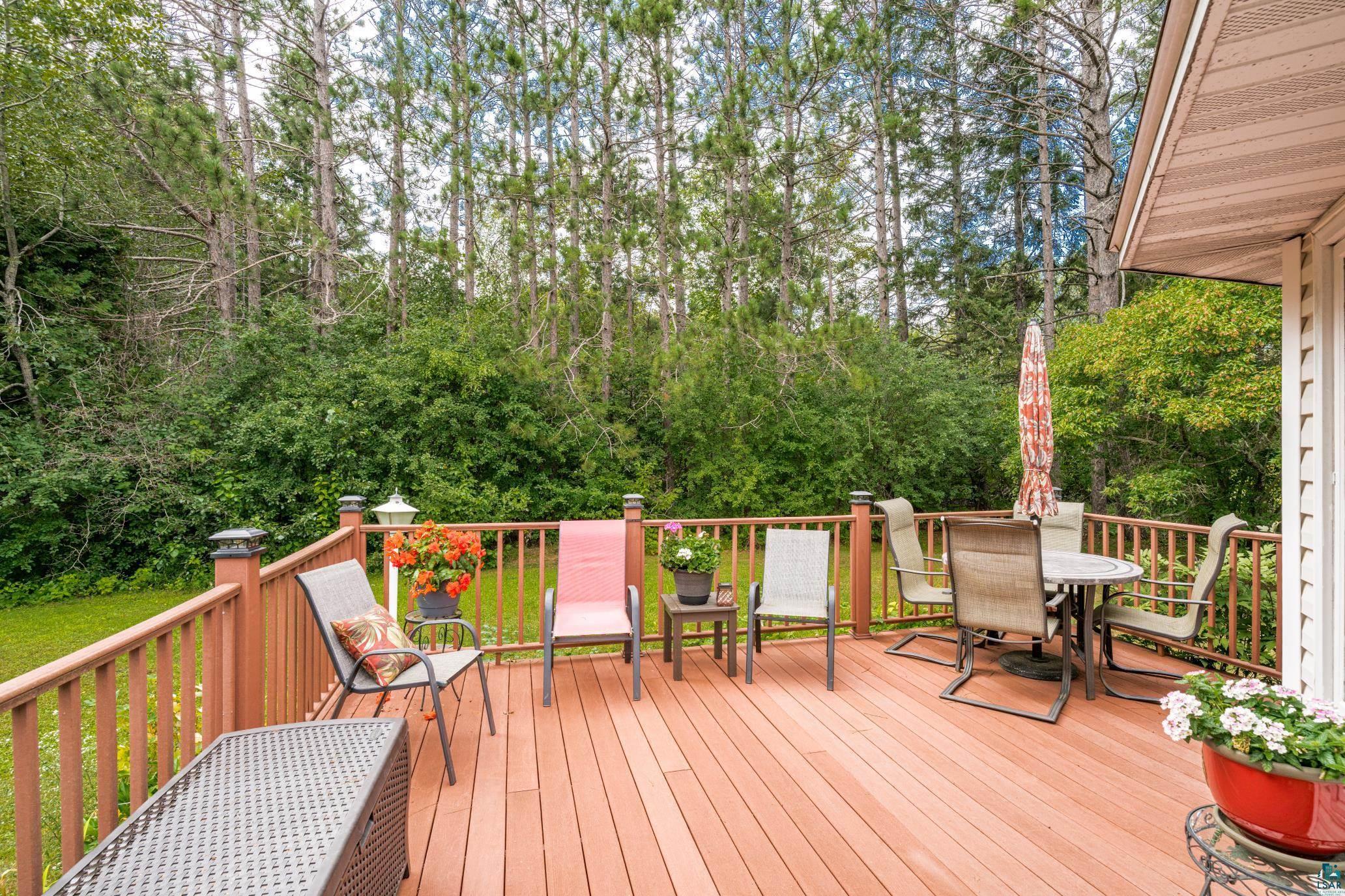 3727 Stebner Road Hermantown, MN 55811 - Photo 3 of 41 Expansive wood-finish deck with a wood railing and integrated post lighting