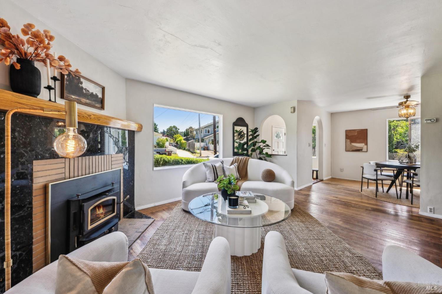 44 Plaza Drive Mill Valley, CA 94941 - Photo 1 of 1 a living room with furniture a fireplace and a dining table with wooden floor