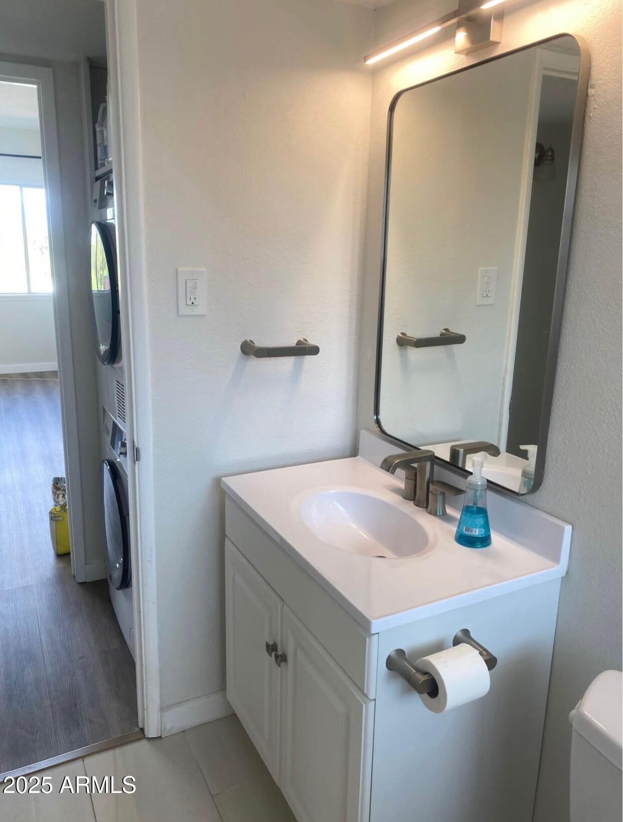 353 East Thomas Road, Unit C404 Phoenix, AZ 85004 - Photo 11 of 18 a bathroom with a sink and a mirror