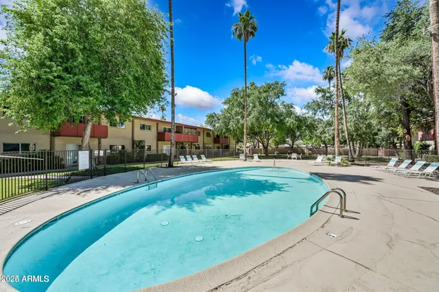 a view of a swimming pool with a patio