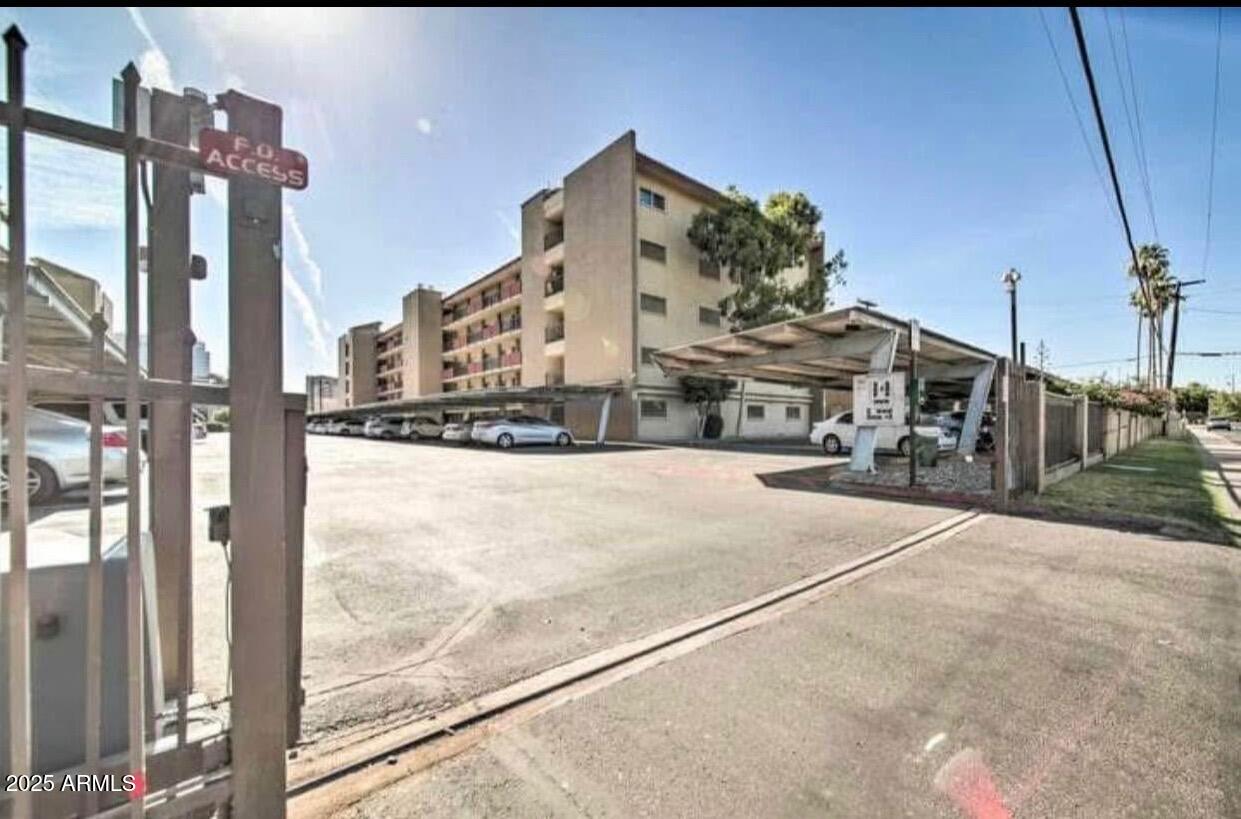 353 East Thomas Road, Unit C404 Phoenix, AZ 85004 - Photo 15 of 18 a view of a building with a street